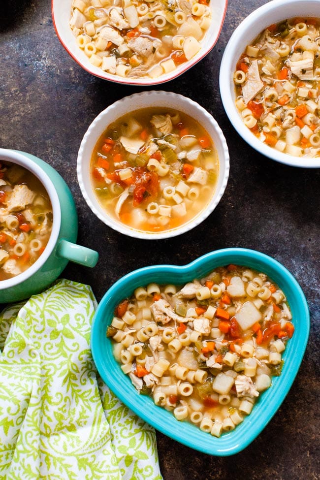 Spicy Chicken Soup from thelittlekitchen.net Spicy Chicken Soup in various sized and shaped bowls with a green towel