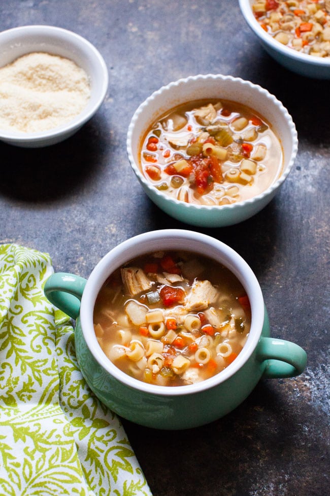 Spicy Chicken Soup from thelittlekitchen.net Spicy Chicken Soup in three different sized bowls and a bowl of parmesan cheese