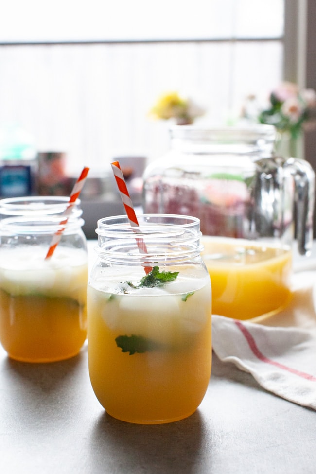 Orange Mint Tea from thelittlekitchen.net orange mint tea in mason jars just inside a window with flowers