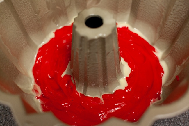 Rainbow Bundt Cake from thelittlekitchen.net Red cake batter in Bundt cake pan