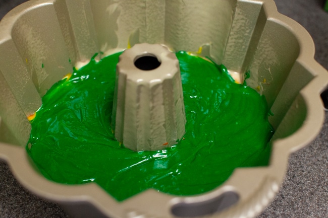 Rainbow Bundt Cake from thelittlekitchen.net Green cake batter in Bundt cake pan