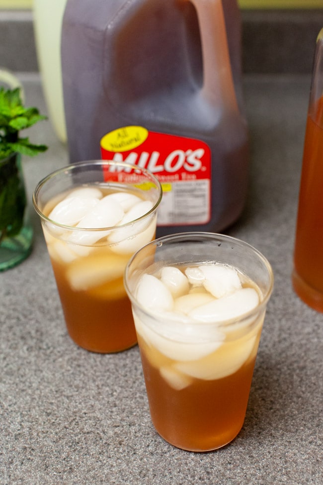 Sweet Tea with Vodka and Lemonade from thelittlekitchen.net two glasses of iced tea with vodka and lemonade on a kitchen counter