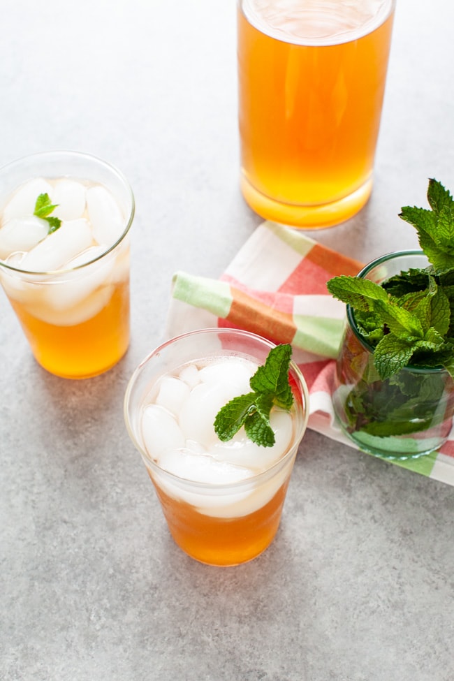 Sweet Tea with Vodka and Lemonade from thelittlekitchen.net glasses with sweet tea vodka and lemonade with fresh mint in a glass in the background
