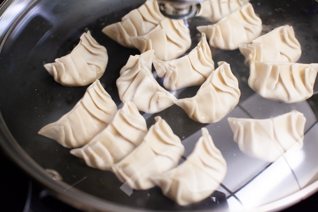 Vegetarian Dumplings from thelittlekitchen.net Vegetarian Dumplings cooking in a covered skillet from thelittlekitchen.net