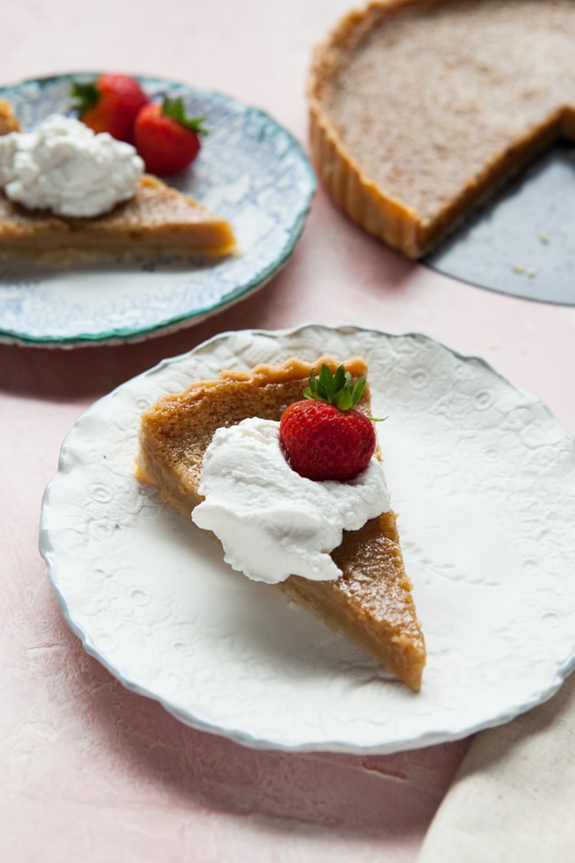 sugar-piTwo slices of Sugar Pie topped with whipped cream and strawberriese-the-little-kitchen-132 Two slices of Sugar Pie topped with whipped cream and strawberries