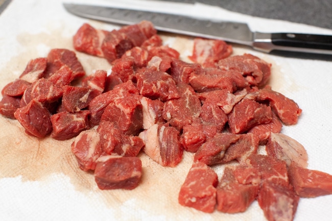 Instant Pot Tortellini Soup from thelittlekitchen.net Chopped beef stew meat on paper towels with a knife in the background.