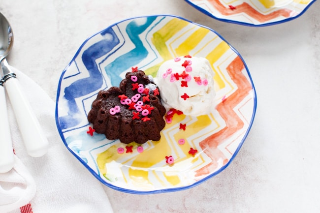 Heart Shaped Chocolate Cake from thelittlekitchen.net heart shaped chocolate cake with vanilla ice cream on a plate with spoons