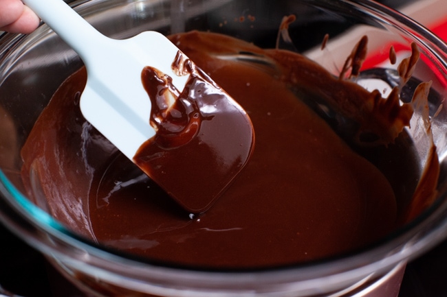 Heart Shaped Chocolate Cake from thelittlekitchen.net melted chocolate in a bowl