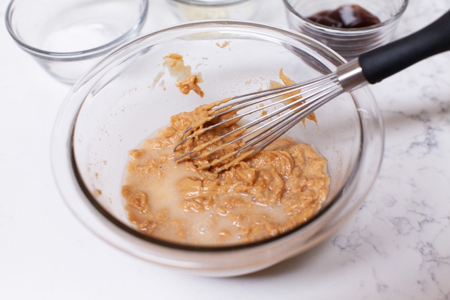 How to Make Peanut Sauce from thelittlekitchen.net peanut butter and water in a mixing bowl making peanut sauce