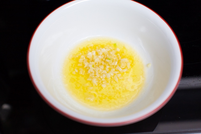 Parmesan Garlic Rolls from thelittlekitchen.net garlic and melted butter in a bowl