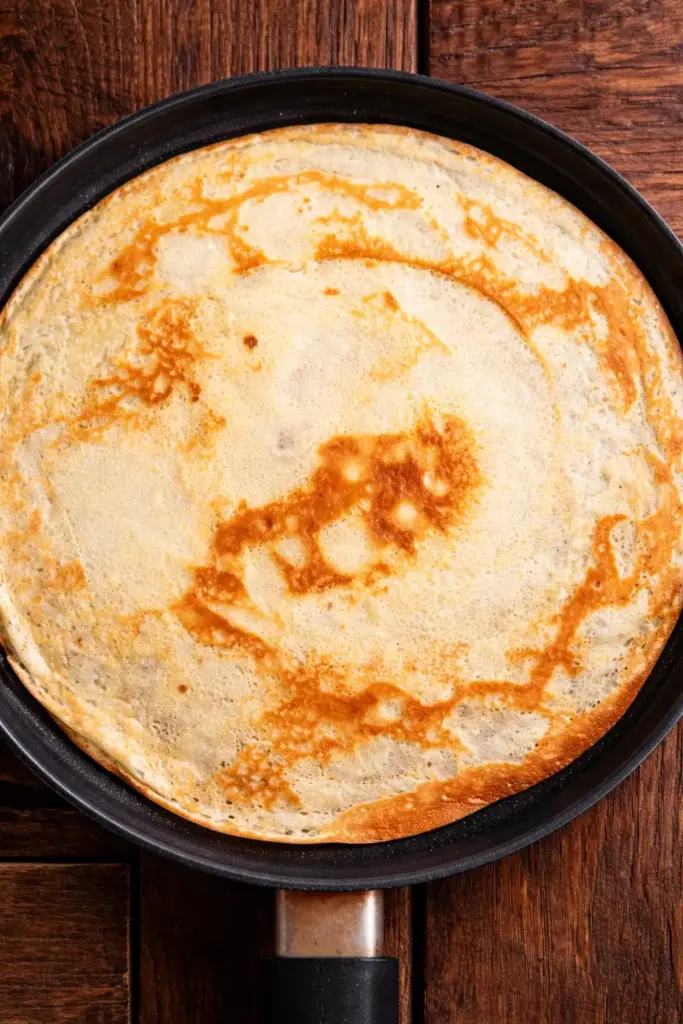 Whisking eggs into flour well